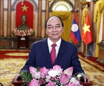 chu tich nuoc moi quan he viet nam lao se tiep tuc no hoa thom ket trai ngot