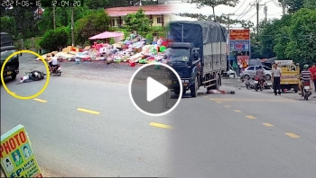 khoanh khac nguoi dan ong nga ra duong dung luc xe tai di toi