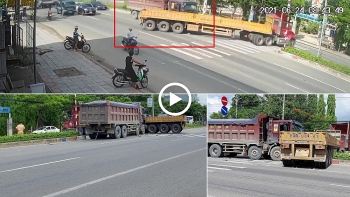 khoanh khac xe ben tong ngang xe container dang sang duong