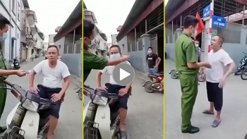 nguoi dan ong bat can bo khau trang truoc mat cong an to ve thach thuc