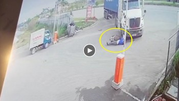 xe may vuot phai va cham voi xe container dang chuyen huong